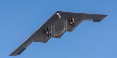 B-2 Spirit stealth bomber in flight with landing gear extended