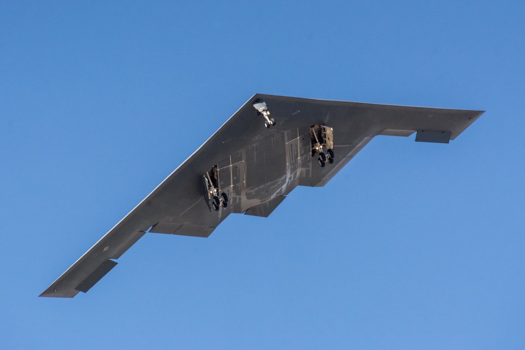 B-2 Spirit stealth bomber flying wing profile viewed from below showing the aircraft distinctive shape and minimal windows